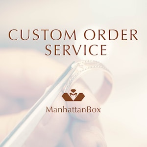 May include: Image promoting custom order services. The text "CUSTOM ORDER SERVICE" is displayed in brown font. A ring is held by tweezers, with the ManhattanBox logo below.