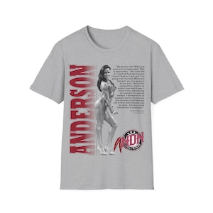 May include: A heather grey t-shirt featuring a black and white photograph of a bodybuilder, the vertical red text ANDERSON, a block of text starting with My doctor said, and a red and black logo with the text INDN ALL-STARS at the bottom.