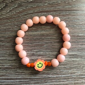 Orange smiley face beaded bracelet