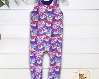 We’re All Mad Here Long Leg Dungaree Romper – Semi-Lined, Purple Galaxy Background. Age 0-6Y