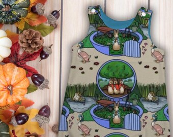 Peter Rabbit and family- Reversible romper with a choice of cuff and lining colours and option to add pockets. Age 0-6Y
