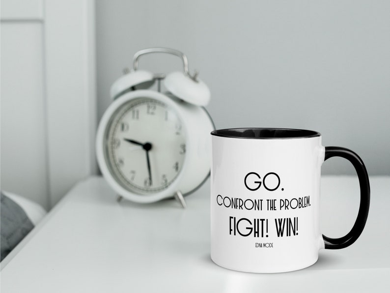 May include: White coffee mug with a black rim and handle. The mug has black text that reads "GO. CONFRONT THE PROBLEM. FIGHT! WIN! IDN MODE".