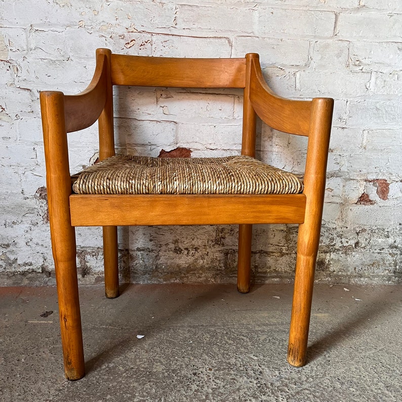 A Carimate carver chair designed by Vico Magistretti image 1