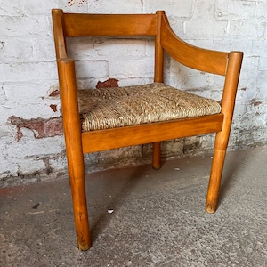 A Carimate carver chair designed by Vico Magistretti image 2