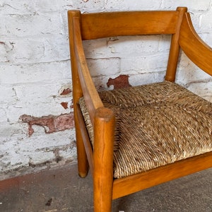 A Carimate carver chair designed by Vico Magistretti image 6