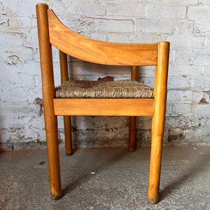 A Carimate carver chair designed by Vico Magistretti image 9
