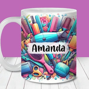 May include: White ceramic mug with a vibrant design of hairdressing tools, including combs, a hairdryer, and scissors. The name "Amanda" is displayed on a white banner. The mug has a white handle.