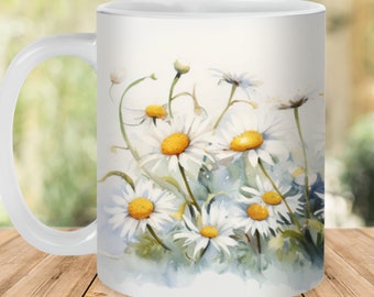 May include: White ceramic mug with a watercolor design of white daisies with yellow centers on a light blue background.