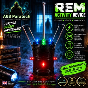 May include: A black cylindrical REM activity device with a central vertical antenna and two angled side antennas. The device features multiple small LED lights in red, green, and blue. Text on the device includes REM ACTIVITY DEVICE, A68 Paratech, and Explore Detect Investigate, along with various feature descriptions.