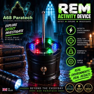 May include: A black cylindrical REM activity device with a central silver telescopic antenna and a toggle switch. The top surface features a circular arrangement of glowing red, blue, and green LED lights. Text on the device includes A68 Paratech.