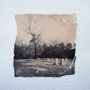 polaroid emulsion lift; black and peach rural graveyard