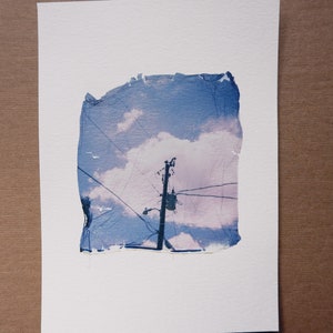 she has her head in the clouds; color polaroid emulsion lift on 5x7 paper