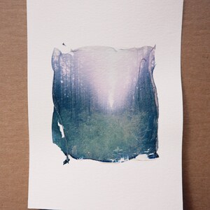into the sunrise between the trees; color polaroid emulsion lift; 5x7 photo on paper