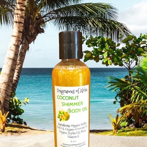 May include: A 4 ounce bottle of Coconut Shimmer Body Oil by Fragrances of Aloha. The bottle is gold and has a black cap. The label is white with black text and a small image of a coconut. The ingredients are listed on the label: Organic Kukui Nut Oil, Organic Coconut Oil, Organic Jojoba Oil, Mica, Vitamin E. The bottle is sitting on a beach with palm trees in the background.