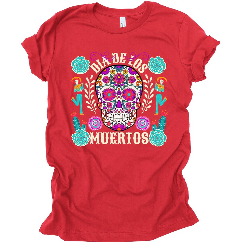 May include: Red t-shirt with a colorful sugar skull design and the text "Dia de los Muertos".