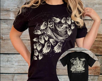 May include: Black t-shirt featuring a ghostly design with the words "My Life" and a cluster of cartoon ghosts. A smaller image of the back of the shirt shows a haunted house with the text "Too Fast For The House".