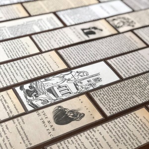 May include: A set of bookmarks featuring illustrations from classic literature. The bookmarks are printed on cream-colored paper with black ink and have a brown border. The illustrations include a man with two faces, a woman with a book, and a man with a sword. The bookmarks are labeled with the titles "The Man with Two Faces", "Seven", and "The Silver  Ruined City".