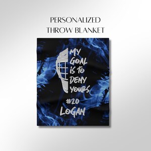 May include: Personalized throw blanket with a blue and black smoke design. The text on the blanket reads "My goal is to deny yours #20 Logan".