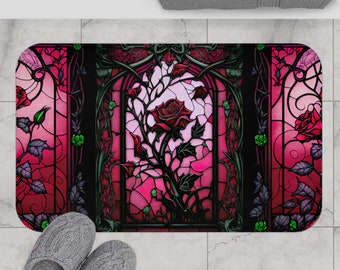 May include: A red rose with green leaves is depicted in a stained glass style. The rose is surrounded by a black frame with a pink and red background.