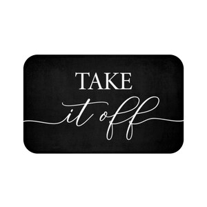 May include: Black doormat with white text that reads "TAKE it off".