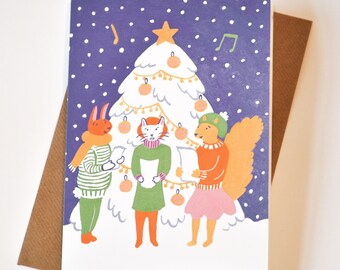 Jolie carte de choeur de Noël - impression d'art animaux Carol chant - une carte de voeux fantaisiste pour les vacances d'hiver - un joyeux cadeau pour elle et lui