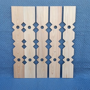 May include: Six wooden fence panels with a geometric design. The panels are made of light wood and have a natural finish. Each panel has a repeating pattern of diamonds and circles.