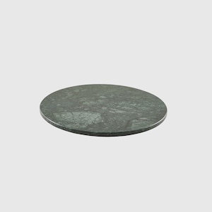 May include: A round green marble serving tray with a mottled pattern.