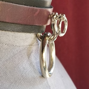 Men&#39;s and Women&#39;s black leather collar with plum leather detail. Silver O-ring & shackle pin. Adjustable buckle closure. Handmade.