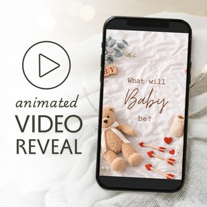 May include: A smartphone displays a baby reveal video with a teddy bear, arrows, and the text "What will Baby be?" The image also includes the text "animated VIDEO REVEAL" and a play button icon.