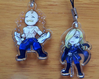 May include: Two clear acrylic charms with black string lanyards. The charms feature anime characters with black hair and blue clothing. One character has a mustache and is holding a white object in each hand. The other character is holding a staff.