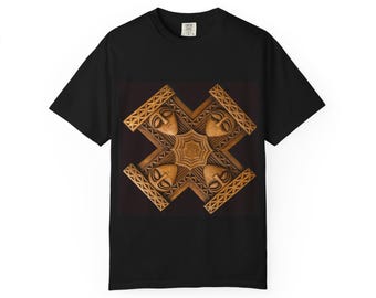 May include: Black t-shirt featuring a detailed, symmetrical design of four carved wooden faces arranged around a central starburst. The faces are light brown, set against a dark brown background, and framed by intricate geometric patterns.