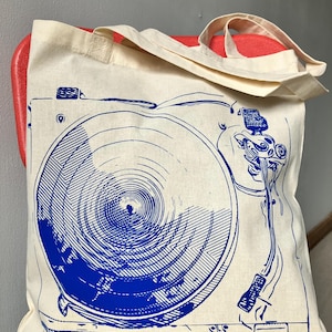 https://www.etsy.com/listing/1805262270/gift-for-record-collector-vinyl-music

record tote bag
vinyl lover gift
dj gift idea
music tote bag
screenprinted tote
musician gift
vinyl record bag
music fan tote
canvas tote for records
record store shopper
hand printed tote
cool music gifts
turntable tote bag