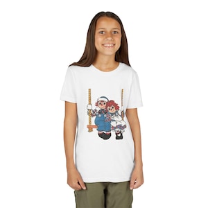 Camiseta juvenil vintage de Raggedy Ann y Andy, diseño de muñecos con personajes de dibujos animados, camiseta gráfica para niños, ropa para niños, top de estilo retro