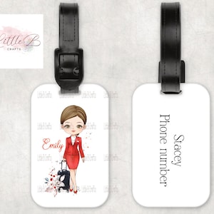 May include: Two white luggage tags with black straps. One tag features a cartoon illustration of a flight attendant with the name "Emily" and a small suitcase. The other tag has the text "Stacey Phone number".