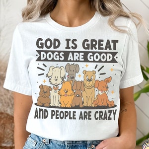 May include: White t-shirt with a graphic of dogs and the text "God is great, dogs are good, and people are crazy".