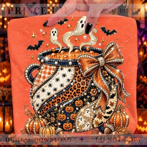 May include: An orange t-shirt featuring a graphic of a cauldron with a large bow, decorated with patterns of spiders, leopard print, and pumpkins. The design includes ghosts rising from the pot, bats, and the text PRINCE:UM ORIGINAL DESIGN.