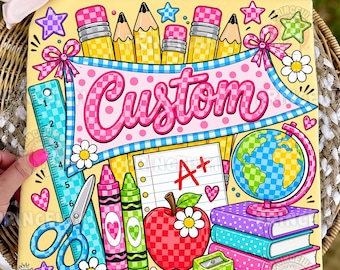 May include: A yellow fabric square featuring a colorful school-themed graphic with the word Custom in pink script. The design includes pencils, a ruler, scissors, crayons, a globe, books, an apple with an A+ paper, and small flower and heart icons.