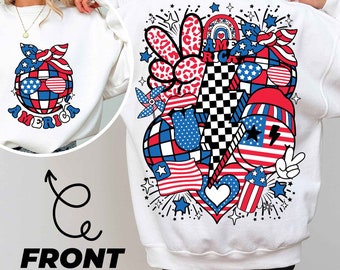May include: White sweatshirt with a red, white, and blue graphic design on the back. The design features a peace sign, a lightning bolt, a heart, and fireworks. The text "I AM AMERICA" is included in the design.