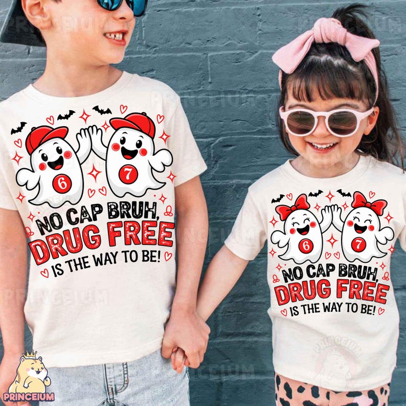 May include: Two off-white t-shirts featuring a graphic of two cartoon ghosts high-fiving. The ghosts wear red caps and have red circles with the numbers 6 and 7 on their chests. Text reads: NO CAP BRUH, DRUG FREE IS THE WAY TO BE!