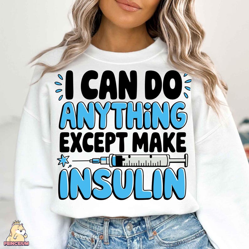 May include: White sweatshirt with a blue and black graphic that says "I can do anything except make insulin".
