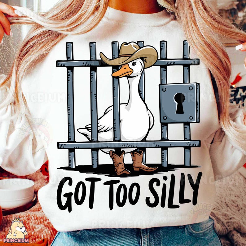 May include: White sweatshirt with a cartoon goose wearing a cowboy hat and boots behind bars. The text "GOT TOO SILLY" is printed below the image.