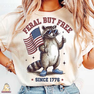 Feral But Free Since 1776 Raccoon Sublimation Design, Patriotic Bow Animal Digital File, Funny 4th of July PNG, USA Independence Day Shirt