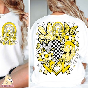 May include: White sweatshirt with a yellow and black graphic design featuring a rainbow, hearts, peace signs, butterflies, and the text "Fight for a Cure".