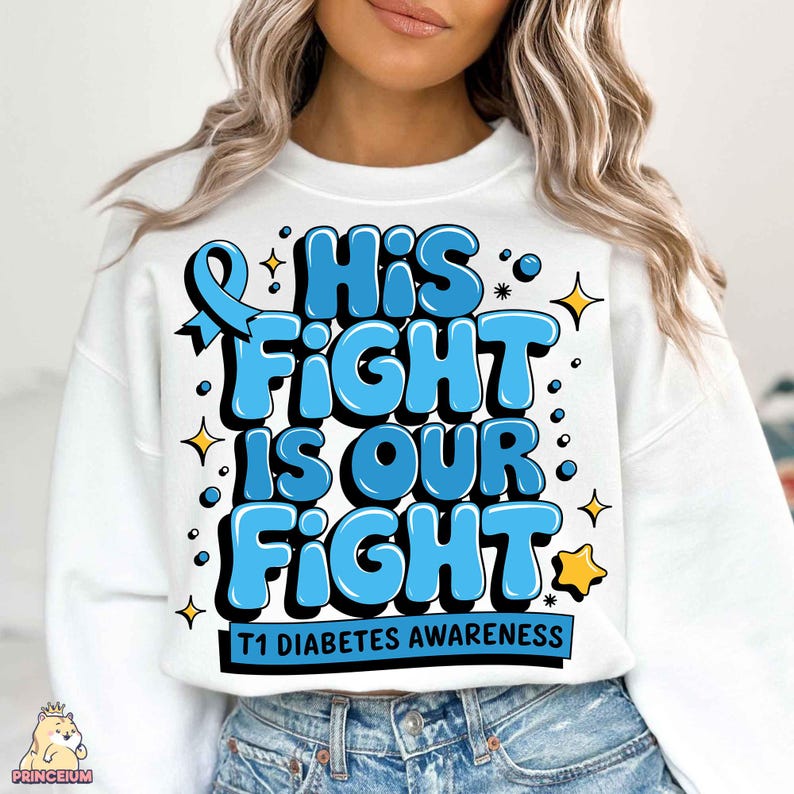 May include: White sweatshirt with a blue ribbon and the text "His Fight Is Our Fight" in blue letters with a yellow star. The text "T1 Diabetes Awareness" is printed below the main text.