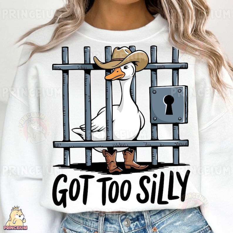 May include: White sweatshirt with a cartoon illustration of a goose wearing a cowboy hat and boots, behind bars. The text "GOT TOO SILLY" is printed below the image.