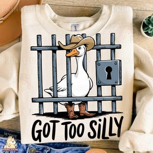 May include: A white goose wearing a cowboy hat and boots is behind bars with the text "GOT TOO SILLY".