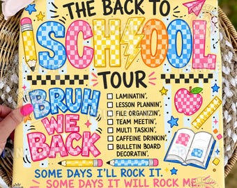 May include: A yellow t-shirt featuring the text THE BACK TO SCHOOL TOUR and BRUH WE BACK with a checklist of tasks including LAMINATIN, LESSON PLANNIN, and CAFFEINE DRINKIN. The design includes colorful checkered letters, pencils, an apple, and a book.