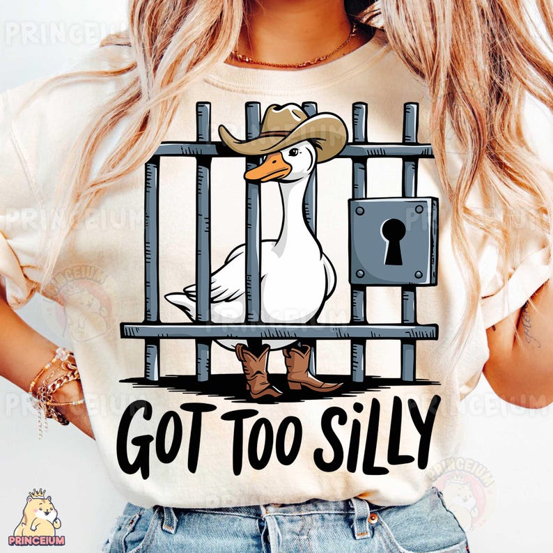 May include: A white t-shirt with a cartoon image of a goose wearing a cowboy hat and boots behind bars. The text "GOT TOO SILLY" is printed below the image.