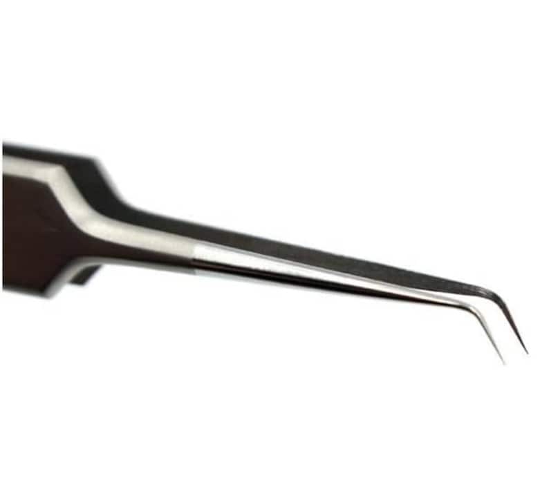 May include: A pair of stainless steel tweezers with a curved tip. The tweezers are designed for precision work, such as picking up small objects or applying adhesives.