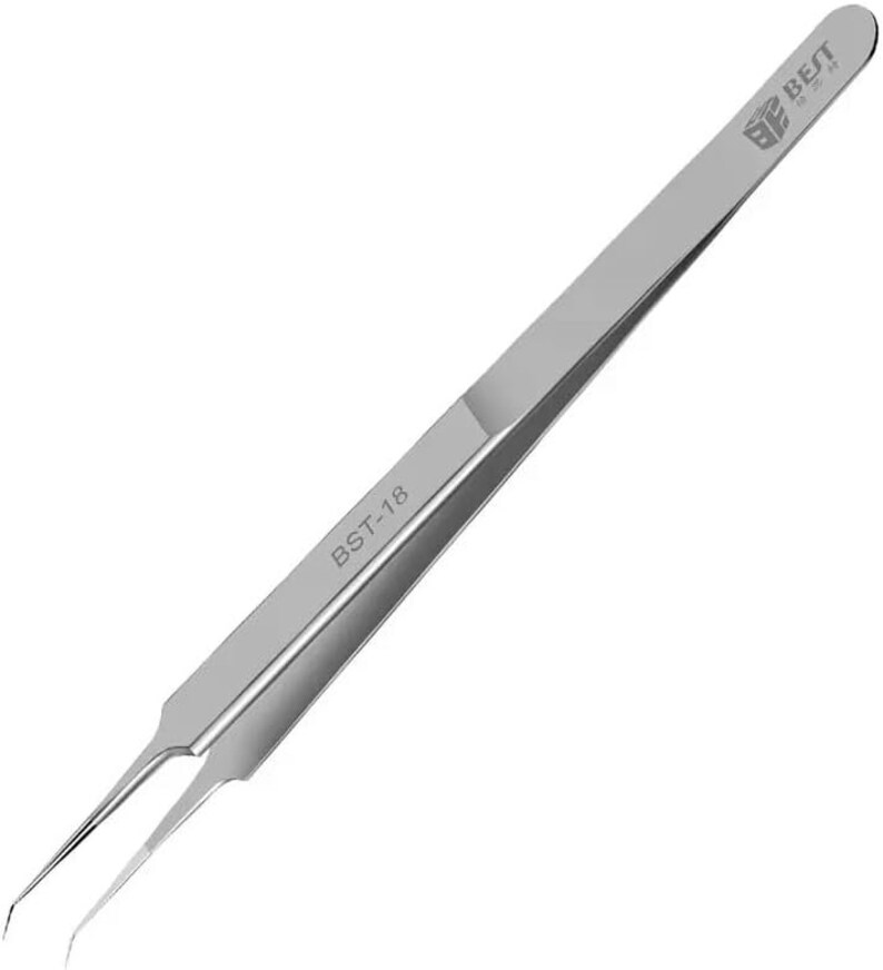 May include: Silver-toned tweezers with a slightly bent tip. The tweezers are labelled "BST-18" and "BE BEST".